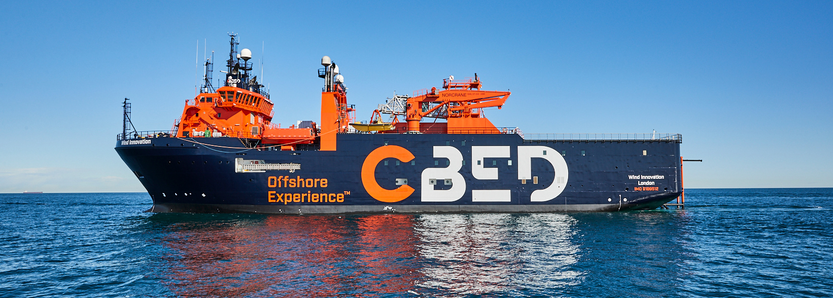Offshore vessel "Wind Innovation" with CBED logo on open sea.