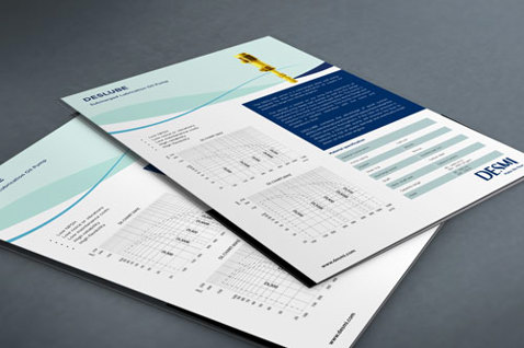 Two DESMI brochures with technical information and images on a table.