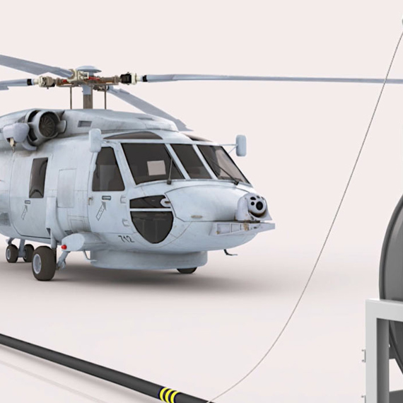 Helicopter refueling from a hose reel system in a hangar setting.