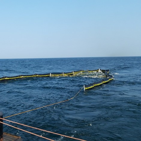 DESMI RO-KITE system deployed in the ocean for oil spill containment.