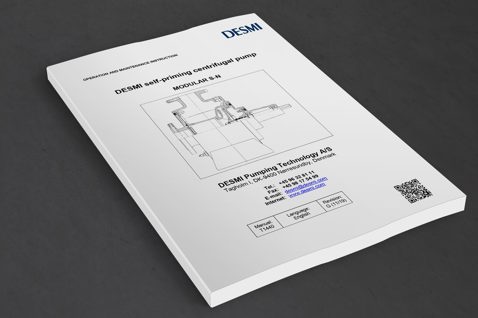 DESMI operation manual for self-priming centrifugal pump, Modular S-N, on dark surface.