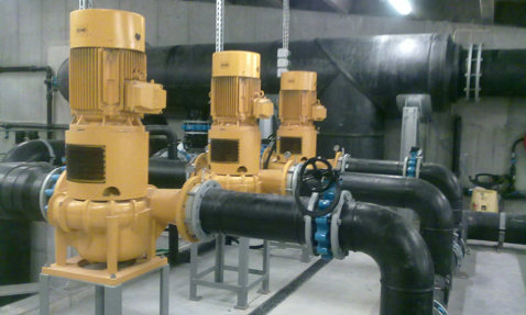 Yellow DESMI pumps in an industrial setting for fluid handling operations.