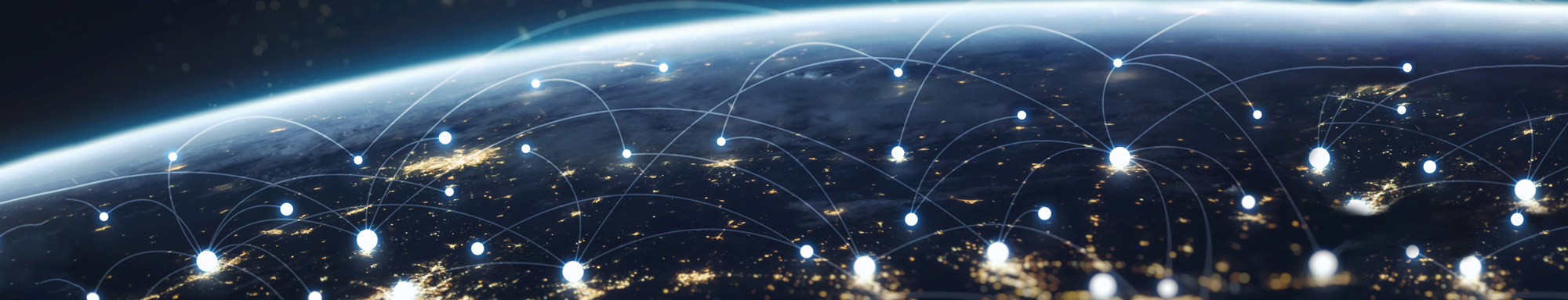 Earth from space with glowing network connections across illuminated cities.