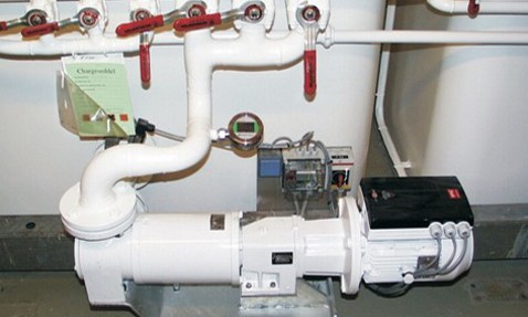 DESMI pump system with pipes and valves for fluid handling operations.