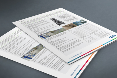 DESMI product brochures with technical details and images on a gray surface.