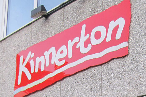 Red "Kinnerton" sign on a building wall.