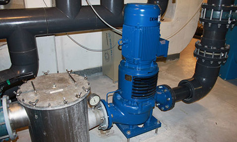 Blue DESMI centrifugal pump installed in an industrial fluid handling system.