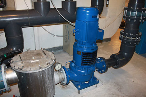 Blue DESMI centrifugal pump installed in an industrial fluid handling system.