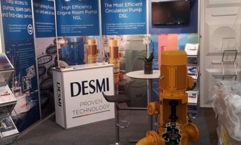 DESMI trade show booth displaying NSL and DSL pumps for fluid handling.