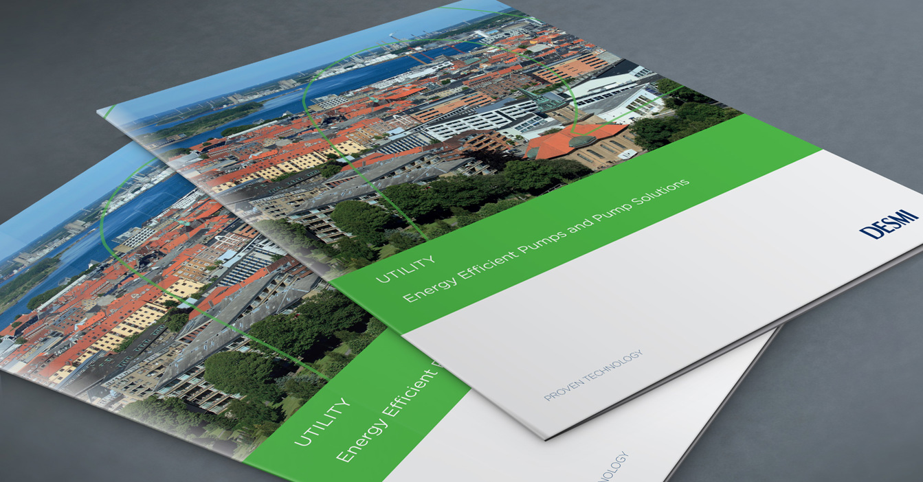 DESMI brochures on energy-efficient pumps and solutions with a cityscape background.