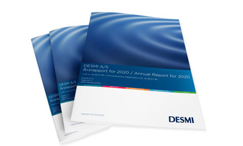 DESMI 2020 Annual Report cover with blue wave design, stack of three copies.