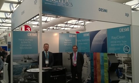 DESMI booth at Pacific 2015 International Maritime Exposition with two men standing.