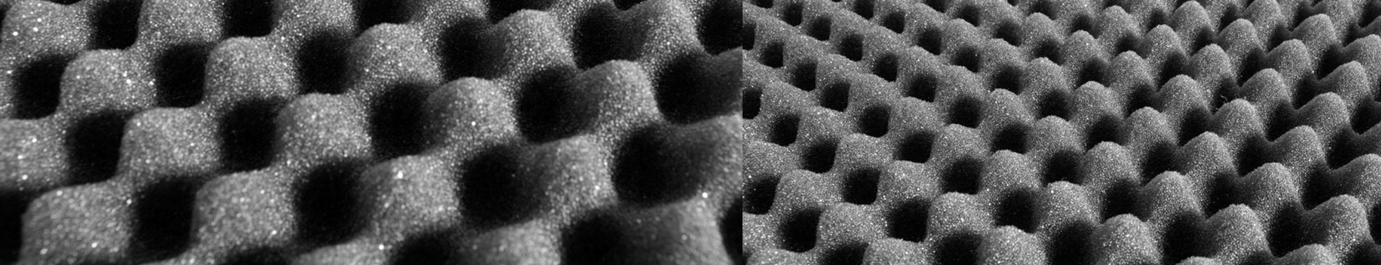 Close-up of dark, textured acoustic foam panels with a wavy pattern.