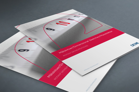 Brochures met een ontwerp van een rolmaat, voorzien van het label "DESMI" voor dimensionale oplossingen.
