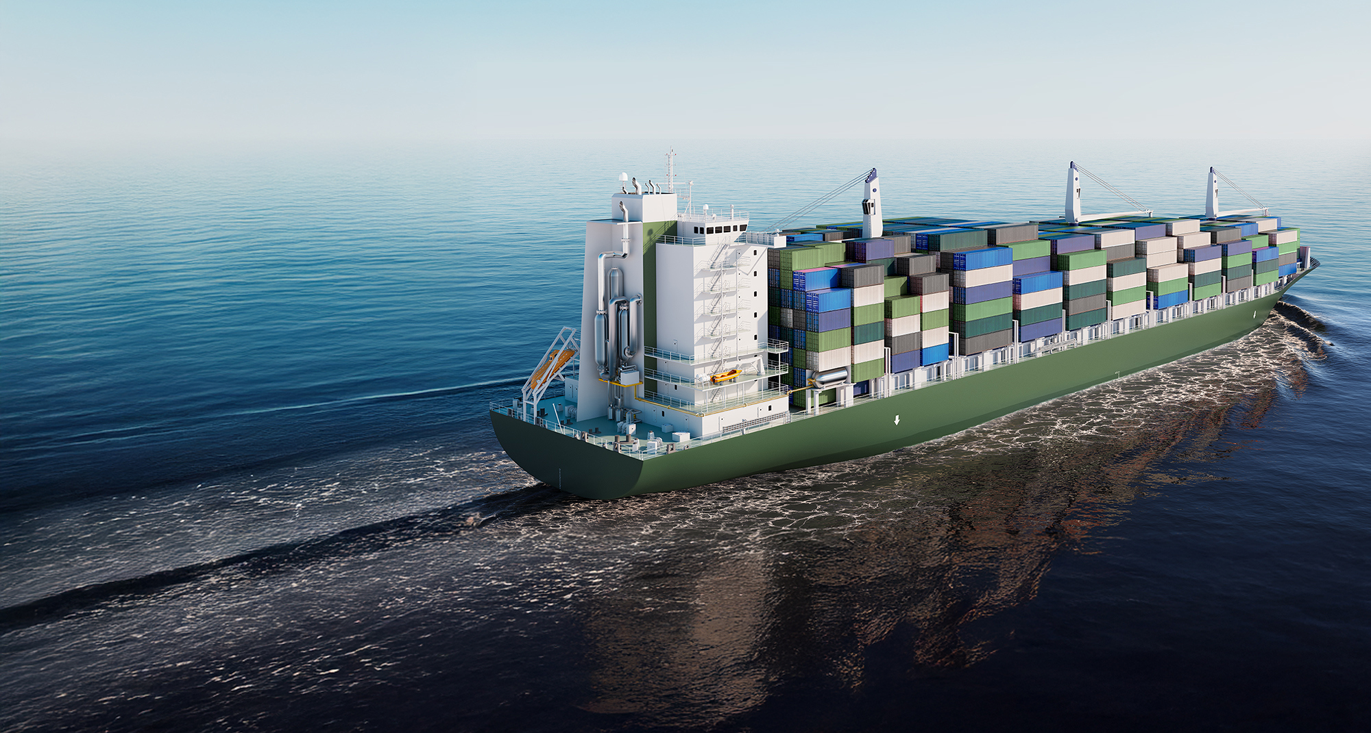 Container ship carrying multicolored cargo sailing on a calm sea.