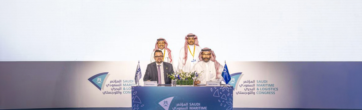 Four men at the Saudi Maritime & Logistics Congress signing ceremony.