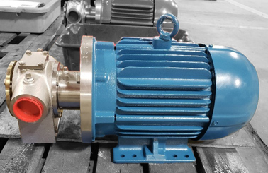 Blue DESMI pump on wooden pallet, used for fluid handling applications.