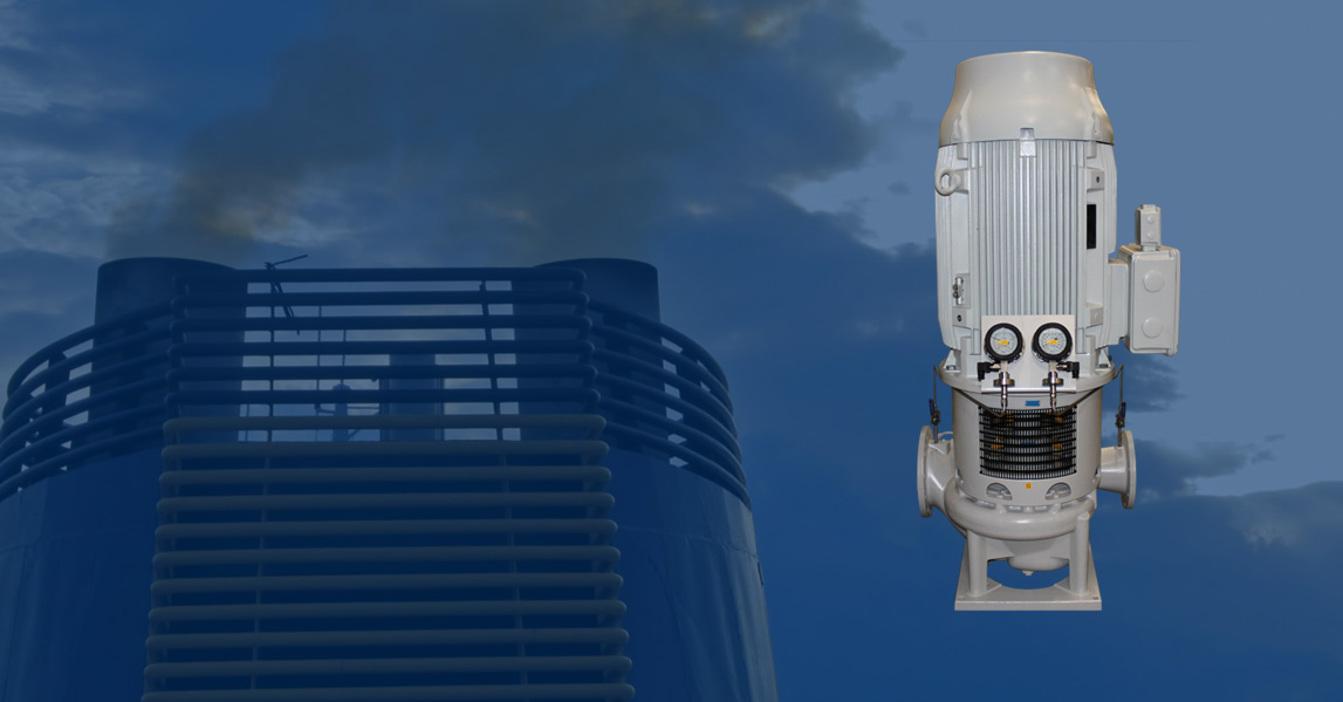 Industrial pump with gauges against a cloudy sky backdrop.