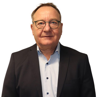 Man in a black sweater and blue shirt against a white background.
