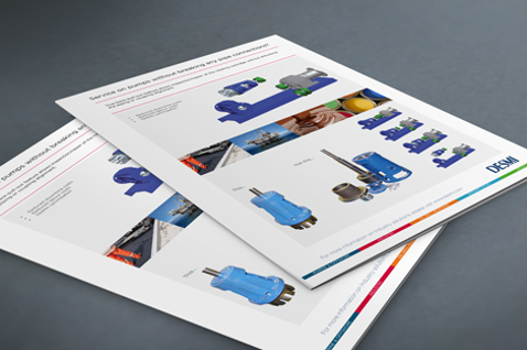 Brochures displaying DESMI fluid handling pumps and equipment on a table.