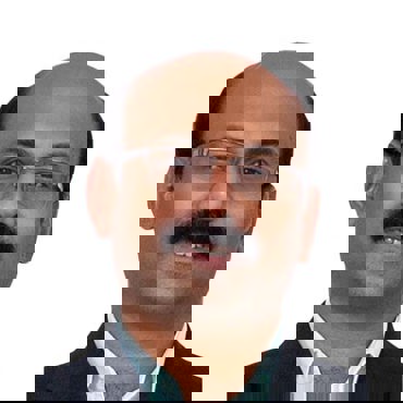 戴眼镜和胡子的男子身穿西装，微笑着看向镜头。