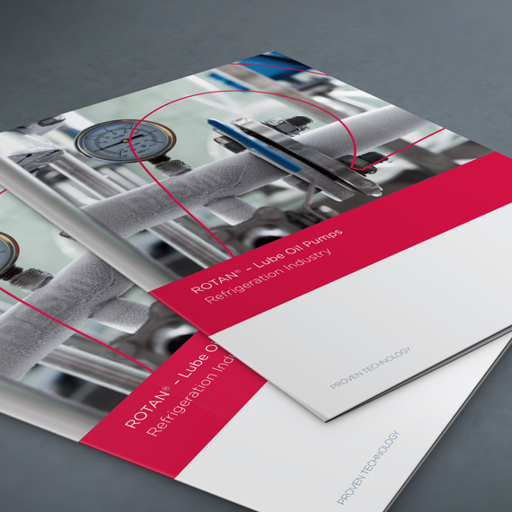 DESMI ROTAN lube oil pumps brochure for refrigeration industry on a table.