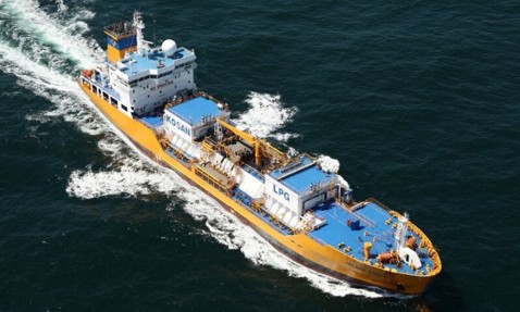 LPG tanker ship navigating the ocean, painted in yellow and blue.