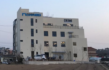 DESMI building exterior with signage, located in an industrial area.