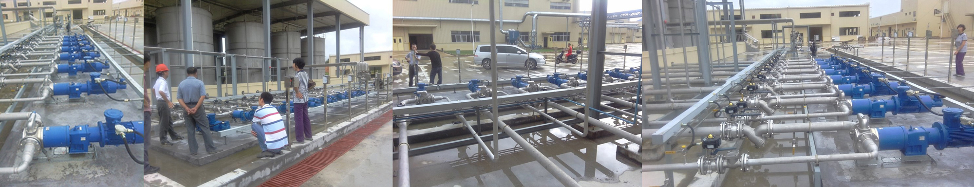 Industrial area with multiple blue pumps and people inspecting the setup.