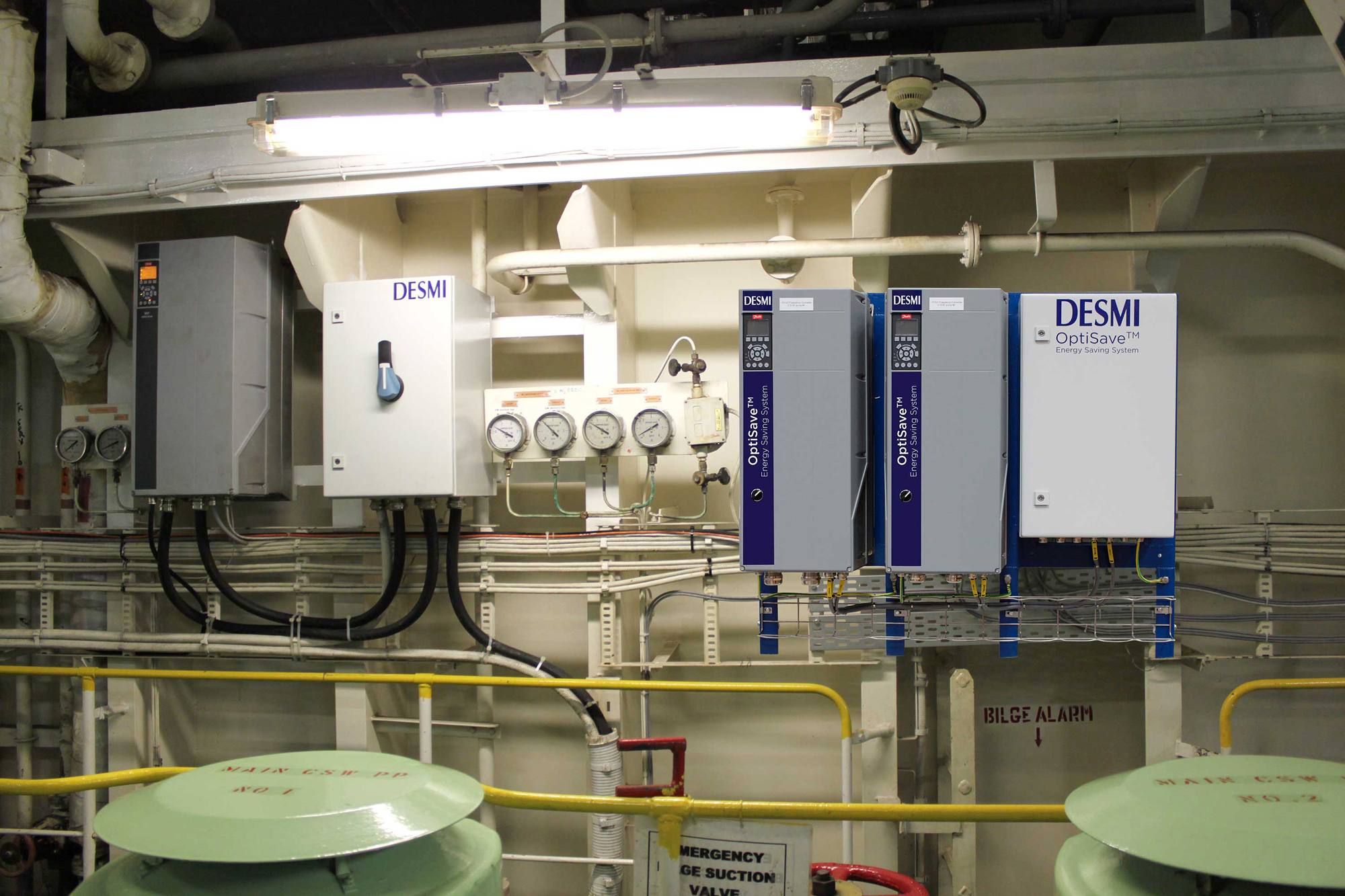 DESMI OptiSave energy-saving system with gauges and control panels for fluid handling.