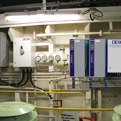 DESMI OptiSave energy-saving system with gauges and control panels for fluid handling.