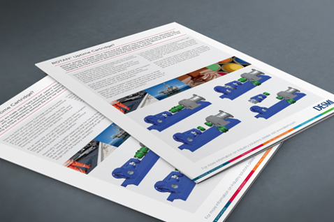 Brochures featuring DESMI pumps for fluid handling on a table surface.