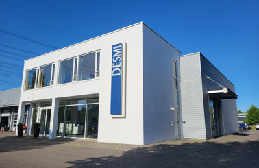 DESMI brochures featuring RO-BOOM oil spill technology on a water surface.