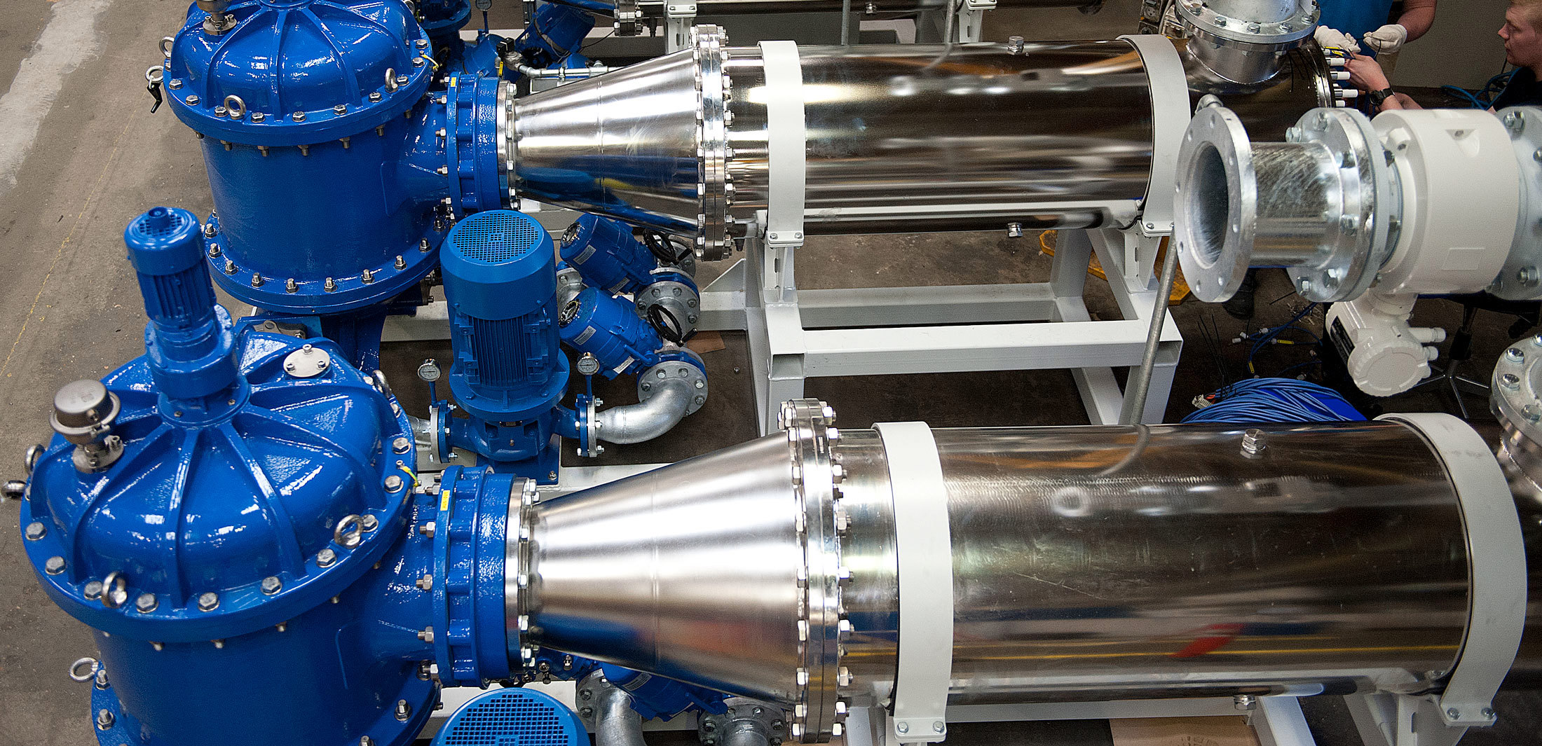 Industrial equipment with blue and silver components, possibly for fluid handling.