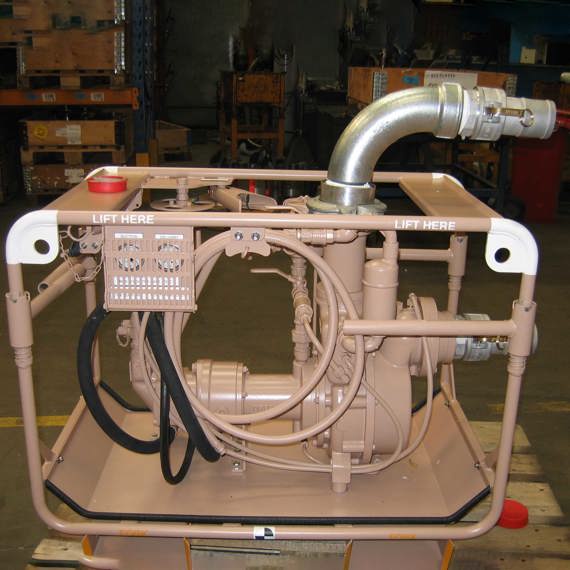 DESMI pump unit for fluid handling, placed on a pallet in a workshop.