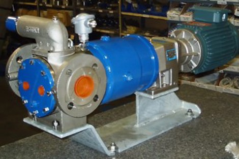 DESMI pump for fluid handling displayed on a workshop table.