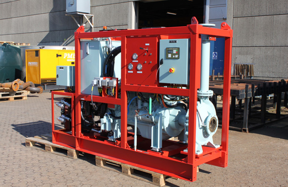 Red industrial pump system on wooden pallets, used for fluid handling.