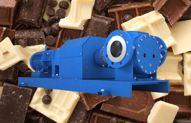 Blue industrial pump in front of various chocolate bars and chips.