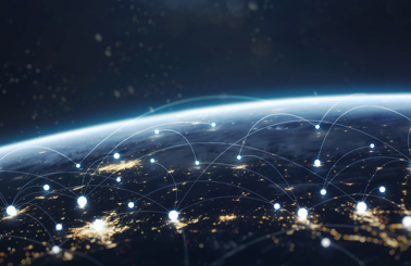 Earth from space with glowing network connections and city lights.