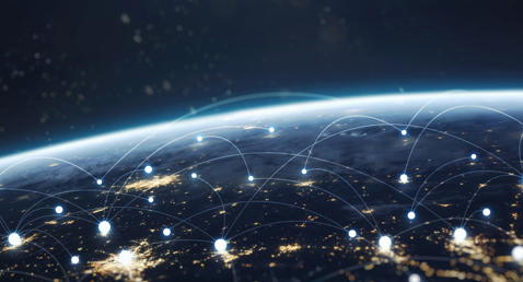 Earth from space with glowing network connections and city lights.