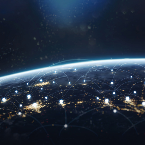 Earth from space with glowing network connections and city lights.