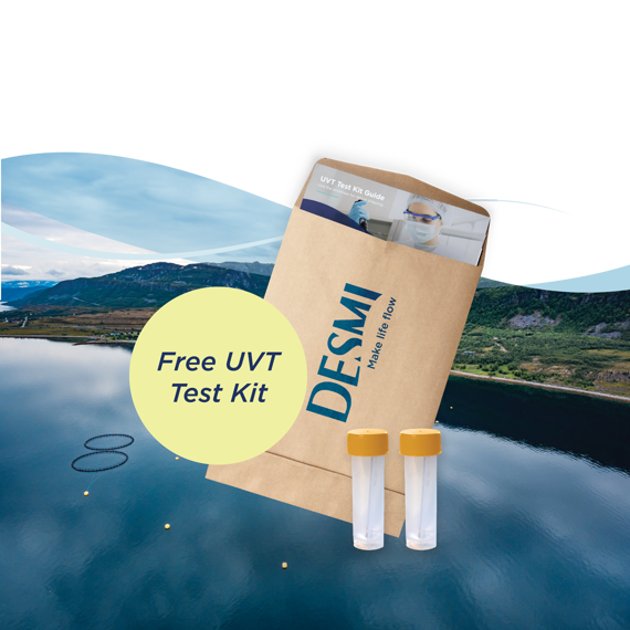 DESMI UVT test kit with vials, against a scenic landscape background.