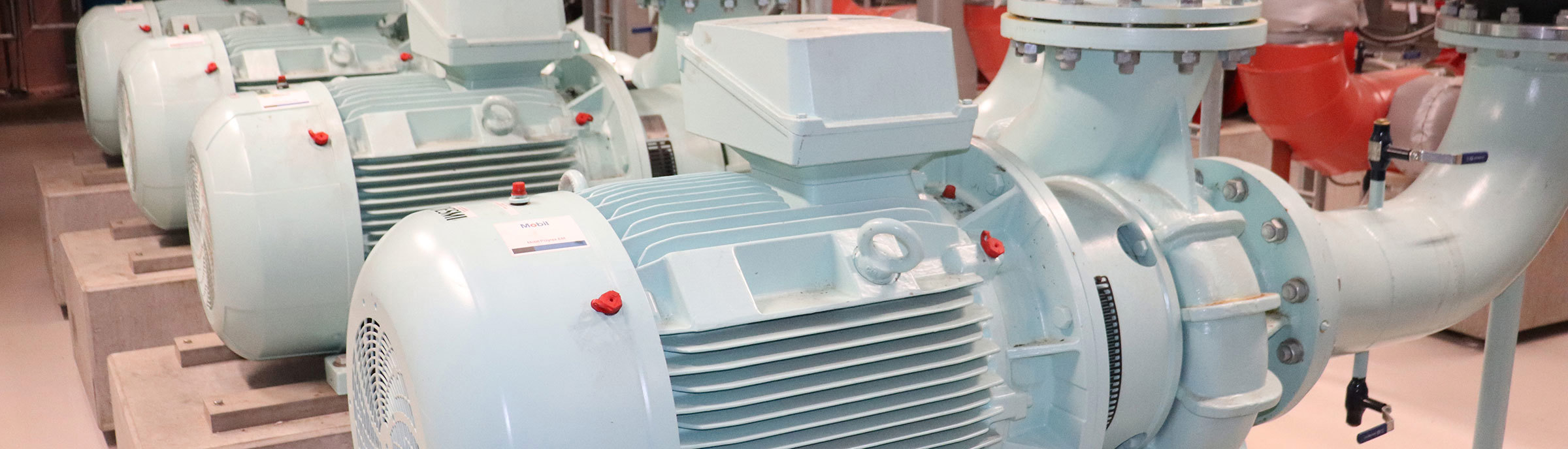 Industrial pumps in a facility, used for fluid handling operations.