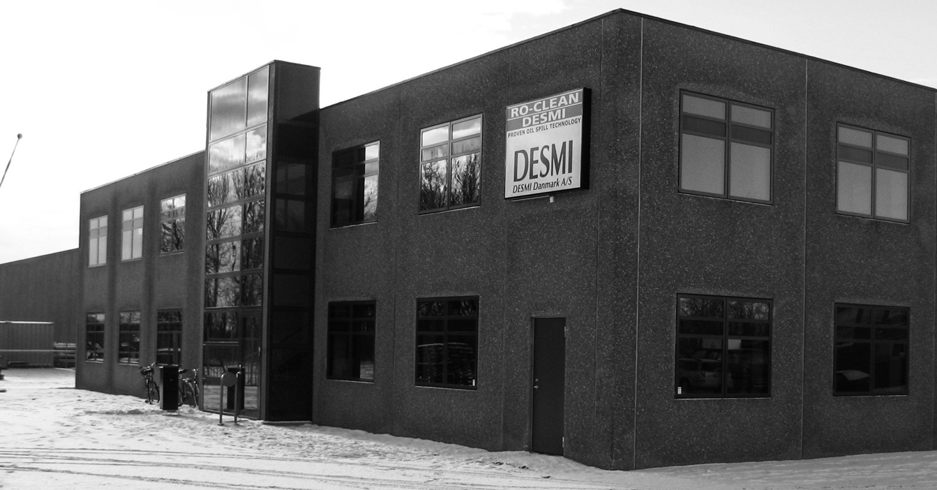 DESMI building in snowy landscape with visible company sign.